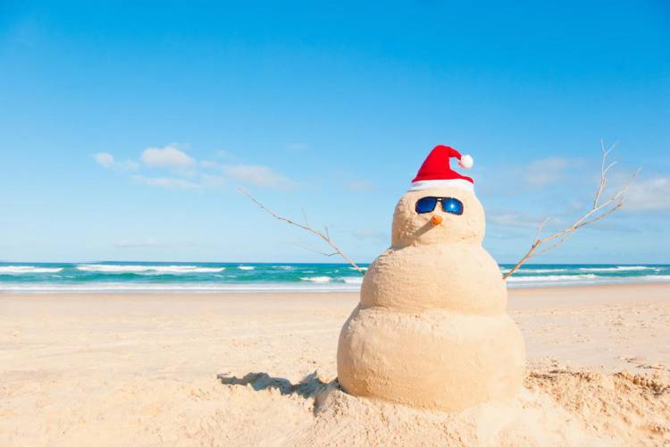 sand snowman tropical holiday